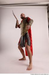Man Adult Average White Fighting with spear Standing poses Casual